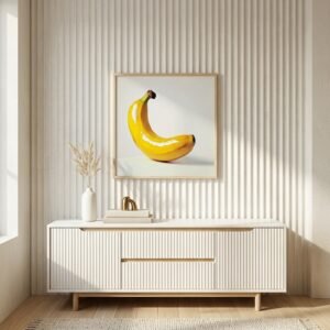 Poster contemporain Banana Pop au-dessus d'un buffet minimaliste blanc.